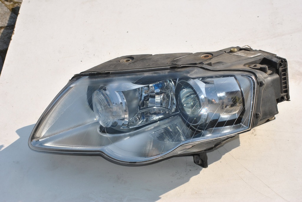 LAMPA LEWA  89312659  VW PASSAT B6 XENON