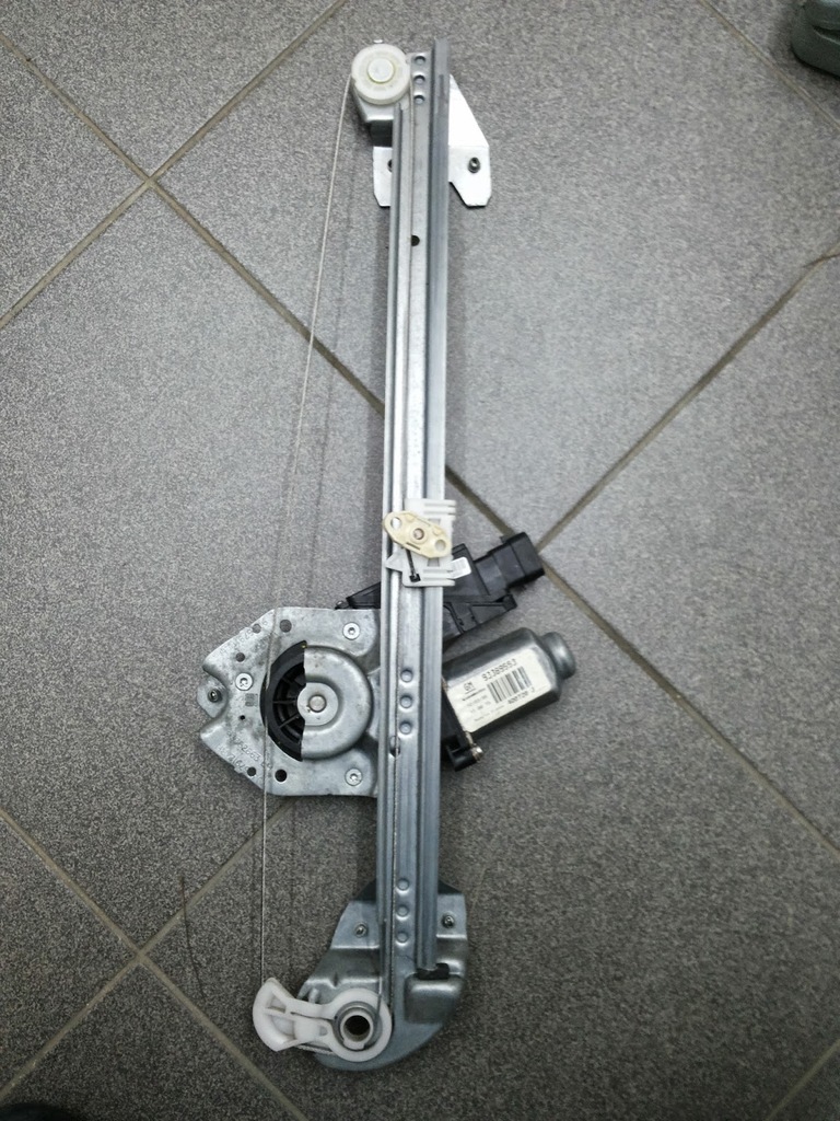 MECHANIZM PODNOSZENIA SZYBY LEWY TYŁ OPEL MERIVA A