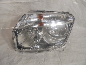 Duster 10-13 лампа передня ліва оригінал нова фото №1