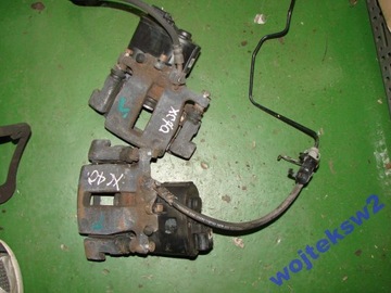 ZACISK HAMULCOWY TYŁ VOLVO S60 V60 S80 V70 XC70 EL