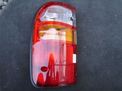 Nowa оригінальна лампа ліва задня toyota hilux -04r фото №1